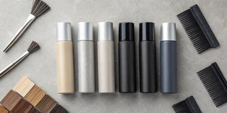 Gray root concealer spray bottles in multi-shade options.