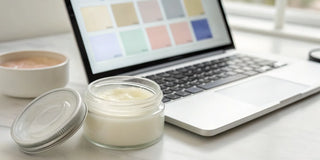 Deep conditioning hair masque for intense hydration in an open jar next to a laptop for buying online.