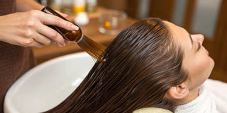 Professional keratin treatment being applied for smooth, shiny, and frizz-free hair.