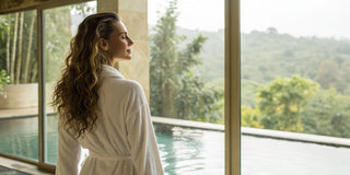 Woman with sleek, smooth hair after receiving a permanent anti-frizz hair treatment.